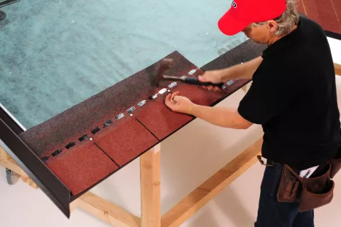 Nail placement on roof shingle
