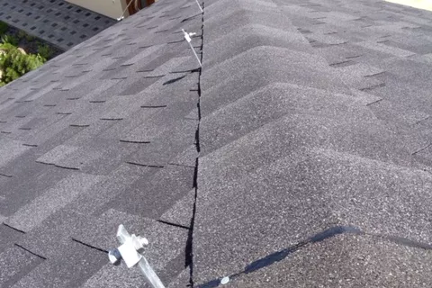 Conductor support for a shingle roof home lightning