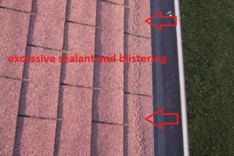 Too much mastic used on shingle roof. Roofer mistakes.