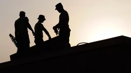 Roofers on a roof during hot weather